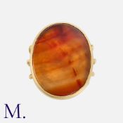 An Agate Signet Ring in 18K gold, with a large oval carnelian agate to 4-strand band (two of rope-
