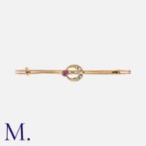 A Ruby and Pearl Crescent Brooch in yellow gold, set with a ruby and half pearls. Unmarked but tests