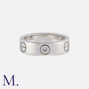 CARTIER. A Classic 3-Diamond Love Ring in 18K white gold set with three diamonds. Signed and