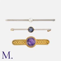 Three Antique 15K Gold Brooches in yellow and white gold. The first a Victorian-era amethyst