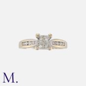 A Diamond Ring in 18ct white gold set with four princess cut diamonds and diamond accents to the