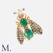 A Gem-Set Insect Brooch in 18k yellow gold, comprising a cabochon emerald set body with ruby eyes,