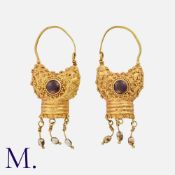 A Pair of Medieval Garnet Earrings in high carat yellow gold. Dating to the 11th to 12th Century