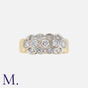 A Diamond Ring in 18ct yellow and white gold set with three rows of diamonds weighing approx. 0.85-