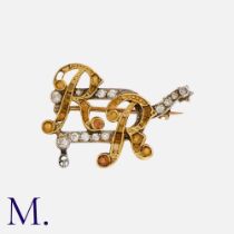 A Monogram Brooch in yellow and white gold, comprising citrine set initials 'R R' set atop a diamond