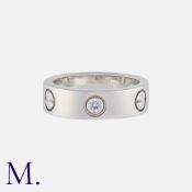 CARTIER. A Classic 3-Diamond Love Ring in 18K white gold set with three diamonds. Signed and