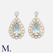 A Pair Of Aquamarine & Diamond Earrings in 18k yellow and white gold, each set with a pear shaped