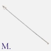 A Diamond Line Bracelet in 18ct white gold, comprising s series of interlocking round brilliant