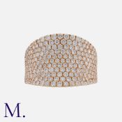A Diamond Ring in 18k rose gold, the concave face pavé set with round brilliant cut diamonds