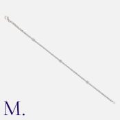 A Diamond Line Bracelet in white gold, comprising a series of interlocking diamond set links,
