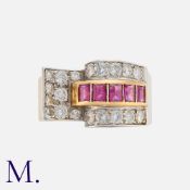 A Retro Ruby And Diamond Ring in yellow gold, set with round cut diamonds totalling approximately