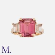 A Pink Tourmaline And Diamond Ring in 18k rose gold, set with a principal step cut pink tourmaline