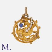 A Sapphire, Diamond and Ruby Chimera Pendant in yellow gold, designed as a chimeras dragon, accented