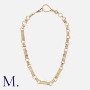 A Gold Collar Necklace in 14k yellow gold, the fancy link chain terminating in two dog clips. Marked