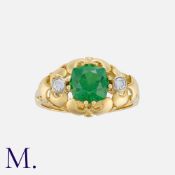 A Green Garnet and Diamond Ring in yellow gold, set with a cushion cut green garnet of approximately