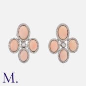 A Pair Of Coral And Diamond Earrings in white gold, comprising four cabochon coral within borders of