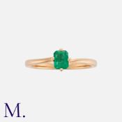 An Emerald Ring in 18k rose gold, set with an octagonal step cut emerald of approximately 0.35ct.