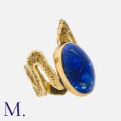 A Large Lapis Lazuli Ring in yellow gold, set with a large cabochon lapis lazuli, to an