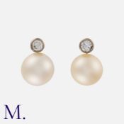 A Pair of Pearl and Diamond Earrings in 18k white gold, each comprising a round pearl beneath a