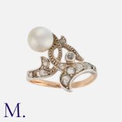 A Natural Pearl and Diamond Ring in yellow gold and silver, of foliate design, set with a natural