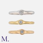 A Trio of Diamond Rings in 18k yellow, white and rose gold, each of hammered finish, set with a