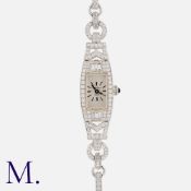 A Diamond Cocktail Watch in 18K white gold, set with round and baguette cut diamonds. Swiss, 17