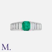 An Emerald And Diamond Ring in 18k white gold, set with an emerald of approximately 0.75ct,