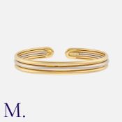 VAN CLEEF & ARPELS. An Open Cuff Bangle in 18K white and yellow gold. Signed VCA and serial