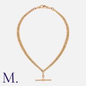An Albert Chain in 9k yellow gold, comprising a series of interlocking curb links. suspending a T-