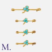 A Set of Antique Turquoise Pins in yellow gold, each of the four pins each feature a central