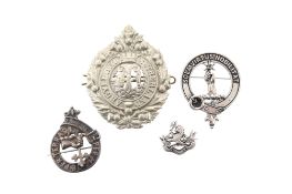 FOUR MILITARY BADGES,