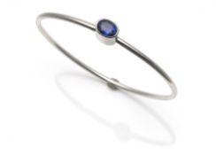 Platinum bangle with sapphire