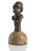 A SMALL BRONZE BUST OF AN AFRICAN MAN WITH FEZ