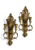A PAIR OF CARVED AND GILTWOOD WALL LIGHTS WITH CARYATIDES
