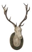 A LIFE SIZE CARVED WOOD DEER HEAD WITH ANTLERS