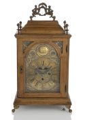 A WOODEN STUTZUHR TABLECLOCK