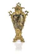 A CONTINENTAL GILT BRONZE MOUNTED FLAMBE PORCELAIN VASE AND COVER