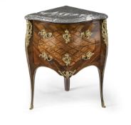 A LOUIS XV ORMOLU MOUNTED AMARANTH MAHOGANY KINGWOOD AND BOIS VIOLETTE PARQUETRY CORNER COMMODE