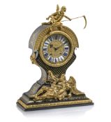 AN EXCEPTIONAL BRONZE MOUNTED TETE-DE-POUPEE BOULLE STLYLE PENDULE