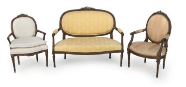A LOUIS XVI CARVED WALNUT SOFA AND TWO FAUTEUILS
