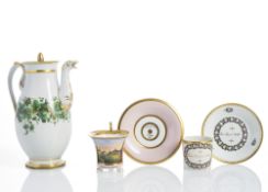 A COFFEEPOT AND TWO CUPS AND SAUCERS