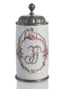 A LARGE PEWTER MOUNTED TANKARD