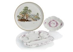 A ROUND PLATE, A SMALL DISH AND A TRAY FOR INKWELLS