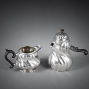A CREAM JUG AND A SMALL CHOCOLATE POT