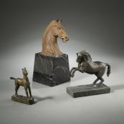 A HORSE HEAD AND TWO BRONZE HORSES