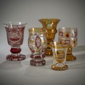 FOUR DECORATIVE GLASS GOBLETS AND A BEAKER