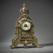 A LARGE BRASS PENDULE