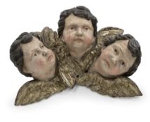 A GROUP OF THREE PUTTO HEADS