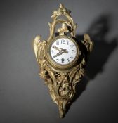 A SMALL FRENCH CARTEL WALL CLOCK