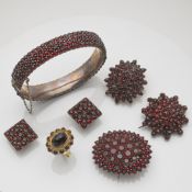 SIX GARNET SET JEWELLERIERS